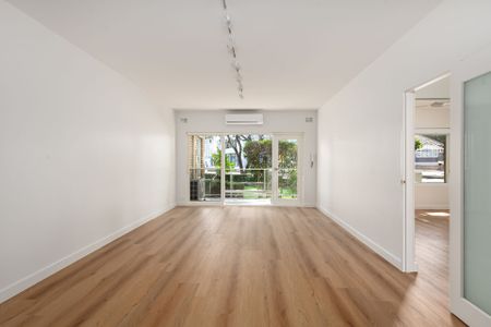 Stylishly Renovated 2-Bedroom Unit with Lock-Up Garage - Photo 2