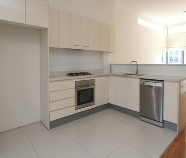 Spacious Two Bedroom Townhouse with Three Car Garage - Photo 6