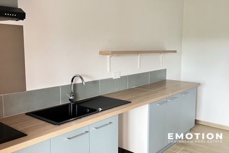 Location Appartement 2 pièces 65m² LES ABYMES 97139 - Photo 2