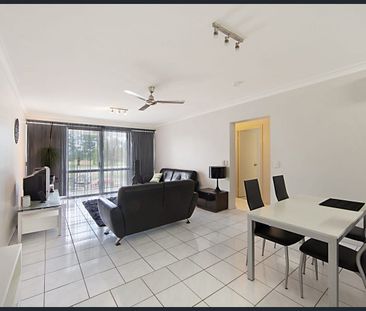 FIRST FLOOR UNIT WITH GOLF COURSE VIEWS & FANTASTIC BREEZES! - Photo 1