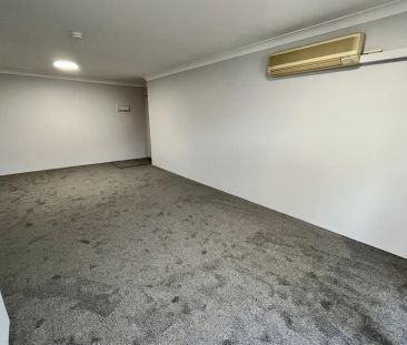 Spacious & Sunlit 2-bedroom unit with lockup garage - Photo 2