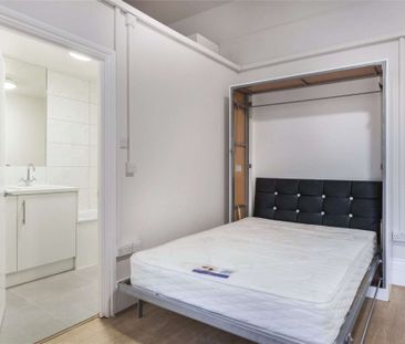 A self contained studio is on the ground floor of a white stucco fr... - Photo 6