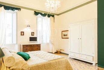 Center-Historic Jewish Quarter: Elegant apartment situated in beautiful Palazzo Nobiliare. Entrance, spacious living with original wood frescoed ceilings, large modern dining and kitchen, 4 bedrooms, 4 Baths, small terrace. #1527