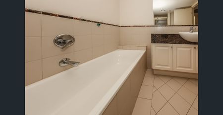 Sophisticated Partly Furnished Apartment with Parkside Views & Resort-Style Amenities - Photo 3