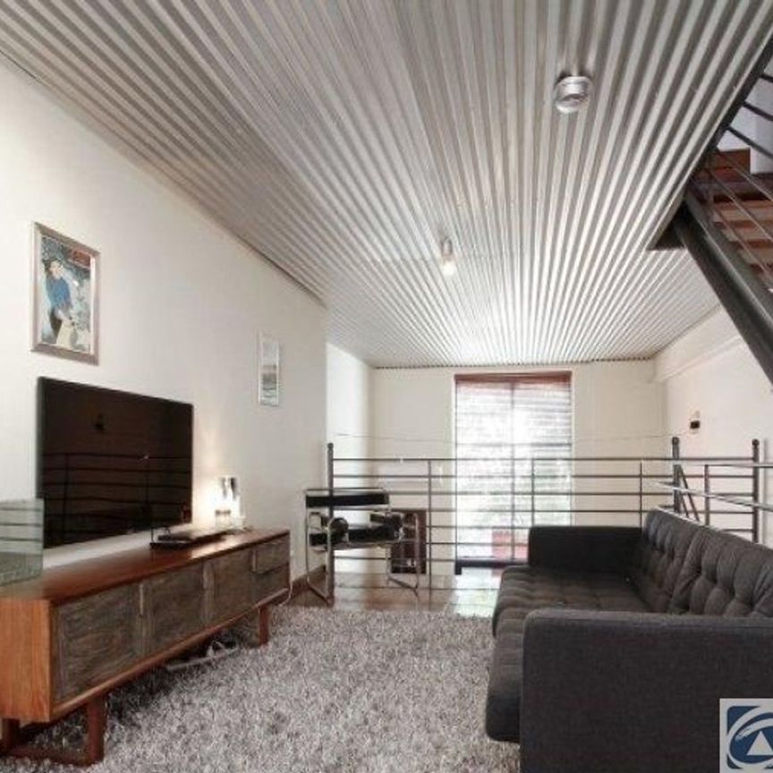 Stunning tri-level townhouse in historic warehouse conversion - Photo 1