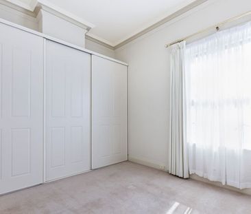 Top-Floor Living with Park Views & Incredible Convenience - Photo 3