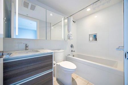 2 Bed Condo | Surrey University District | Parking • Den - Photo 2