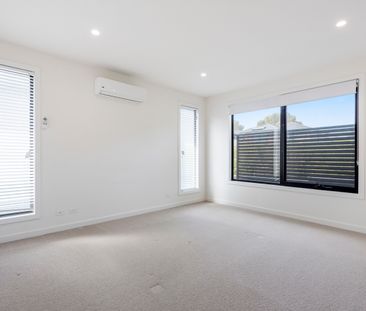 Modern Two-Story Brick Townhouse with Stylish Features - Photo 5