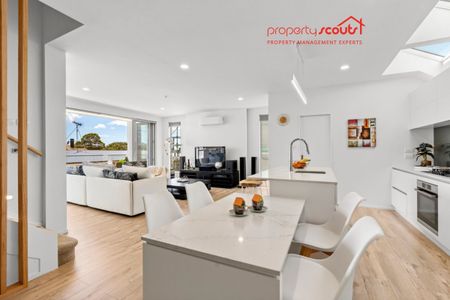 Spacious Designer Home with Flexible Living Across Three Levels - Photo 2