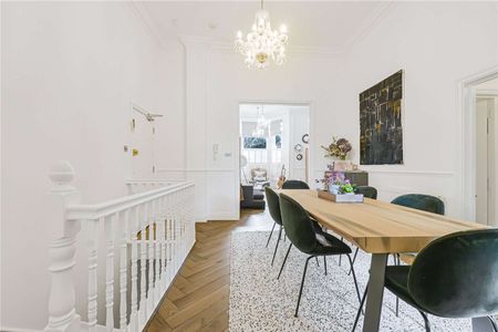 A beautifully presented three bedroom apartment set over the ground and lower ground floor with direct access to a private patio. - Photo 3