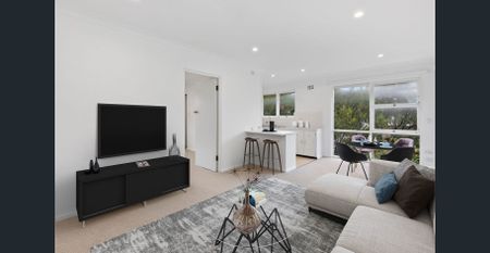 Sunny Top-Floor Retreat Offering Convenience and Coastal Living - Photo 5