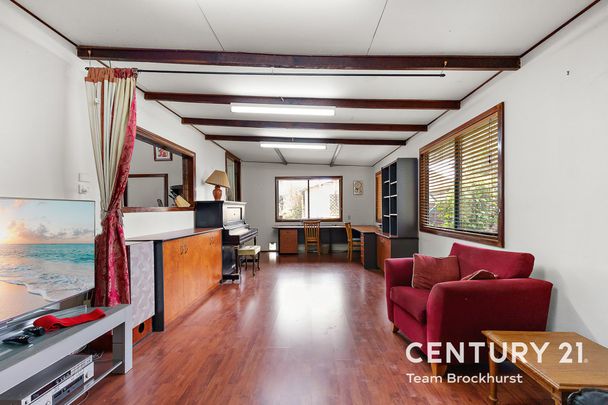 Charming 1950s Home with Modern Flexibility & Pristine Gardens! - Photo 1