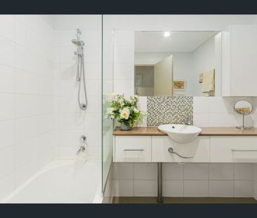 TOP FLOOR UNIT IN PRIME LOCATION, SHORT STROLL TO MAJOR SHOPS - Photo 2