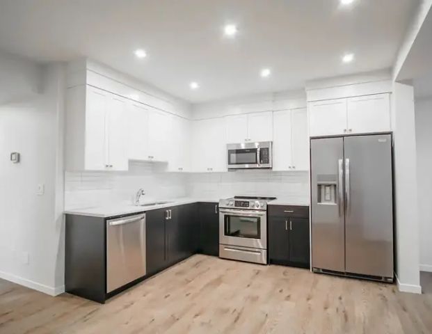 ONLY $1,495 - New and updated!!!!! 2 BEDROOMS and 1 BATHROOM EXECUTIVE SUITE!! | Seton SE, Calgary - Photo 1