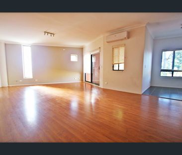 Full Brick Townhouse of Two Bedroom One Bathroom with Garage! - Photo 1