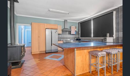 This charming 3-bedroom, 1-bathroom home offers spacious and practical living, making it an ideal place to call home. - Photo 4