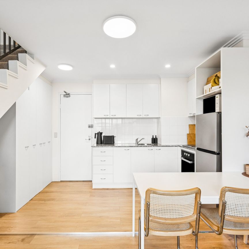 Executive Style Split-Level One Bedroom with Dual Balconies - Photo 1