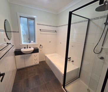 Luxuriously renovated home with landscaped gardens & security system - Photo 5