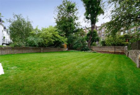 Newly refurbished, four double bedroom ground and lower ground floor apartment on Lexham Gardens. - Photo 2