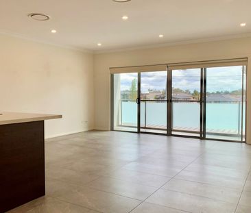 GENEROUS MULTI LEVEL TOWNHOUSE IN A MODERN COMPLEX - Photo 1