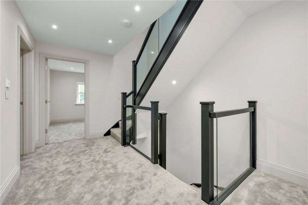 Beautifully finished new-build home just 0.5 miles from Walton-On-Thames Station. This five bedroom family residence combines contemporary design and cutting-edge technology. - Photo 1