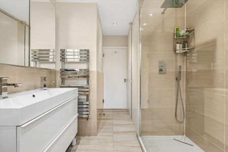 A substantial and beautifully presented three-bedroom ground floor apartment, ideally positioned opposite Wimbledon Common on the prestigious Wimbledon Park Side. - Photo 3