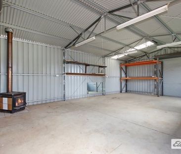 Charming 3-Bedroom Home with Outdoor Extras & Workshop! - Photo 3
