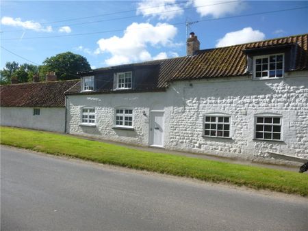 The Old School Rooms is a semi-detached cottage. It consists of a kitchen, utility room, living room with a multi-fuel stove, bathroom, downstairs WC and two bedrooms. The property benefits from oil central heating, off road parking and an enclosed rear garden. - Photo 2