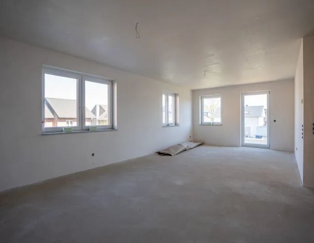 Eine Neubauwohnung mit einem sehr großen Garten und einer tollen Terasse - Foto 1