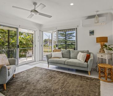 Furnished Beachfront Living – Renovated 2-Bedroom Apartment - Photo 2