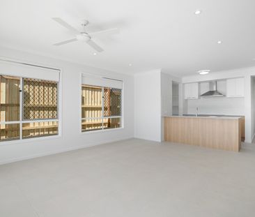 Spacious 4-Bedroom Home in the Heart of Redbank Plains! - Photo 1