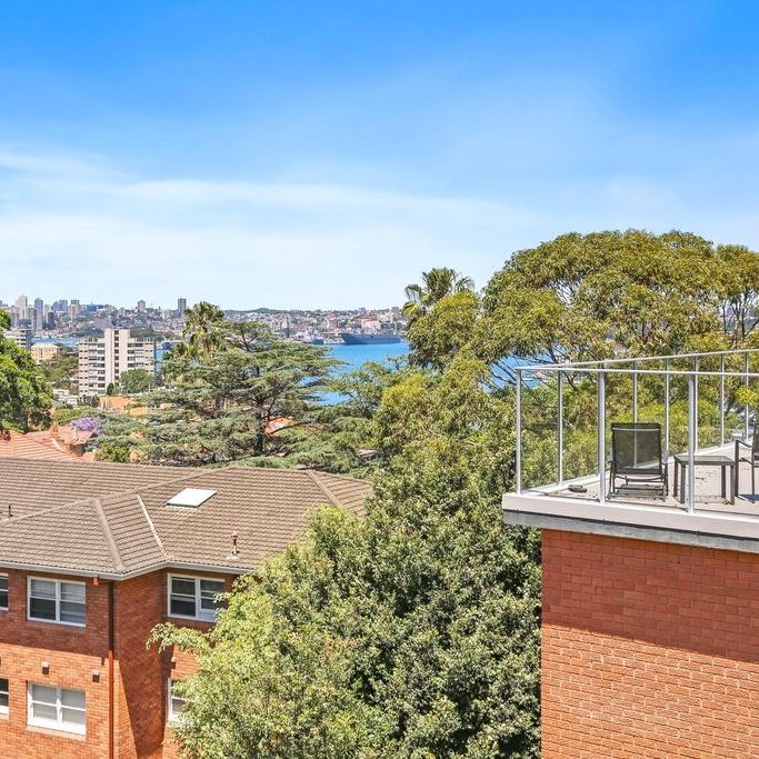 Top floor one bedroom apartment with glimpse of water views - Photo 1