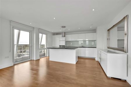 Situated on the eleventh floor, the property enjoys the benefit of a private balcony as well as access to the communal grounds of the development which overlook the river and Canbury Gardens - Photo 4
