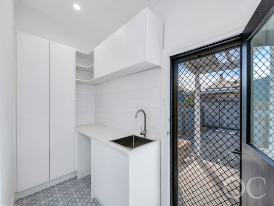 Open the Door to Coastal Charm with Modern Comfort - Photo 1