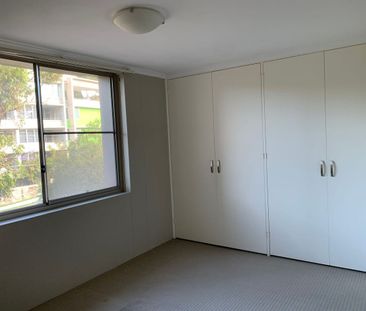 Stylish & Bright 2-Bedroom Apartment with Undercover Parking - Photo 4