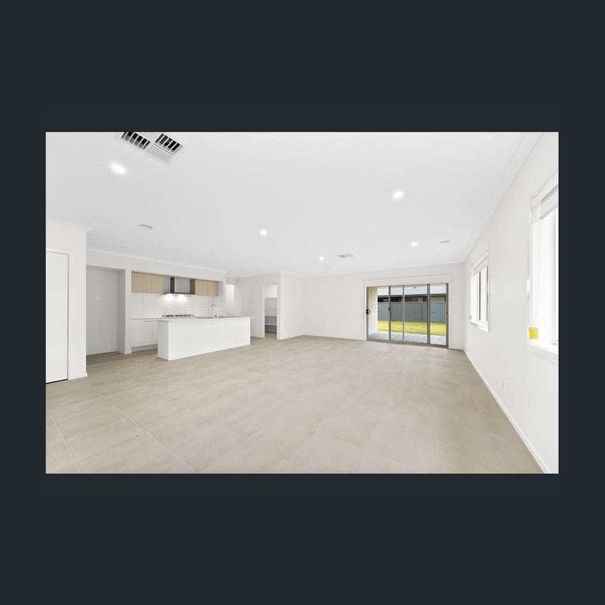 FOUR BEDROOM HOME WITH TWO LIVING AREAS AND DUCTED HEATING AND COOLING - Photo 1