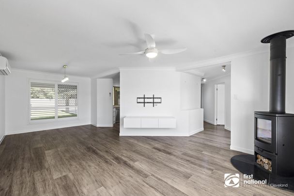 STUNNING LOW SET FAMILY HOME IN WELLINGTON POINT - 4 BEDROOMS + STUDY - Photo 1