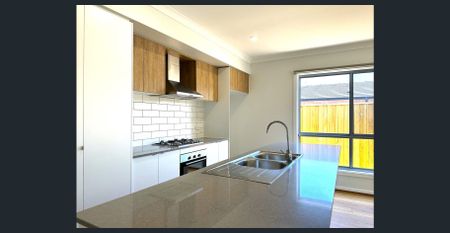 Spacious Family Home with Modern Comforts in Prime Wyndham Vale Location! - Photo 3
