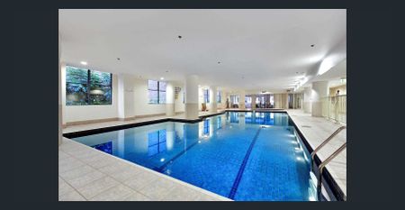 Spacious 2-Bedroom Apartment | Ultimate CBD Convenience - Photo 2