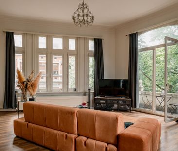 Eclectisch appartement in opvallend hoekgebouw ‘Den Wolf’ op Zurenborg - Photo 2