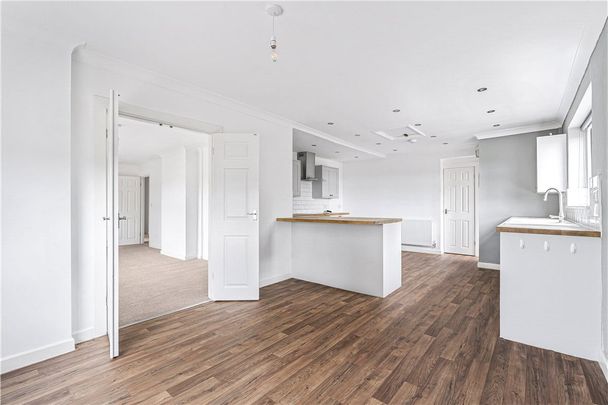 A detached four bedroom bungalow. - Photo 1