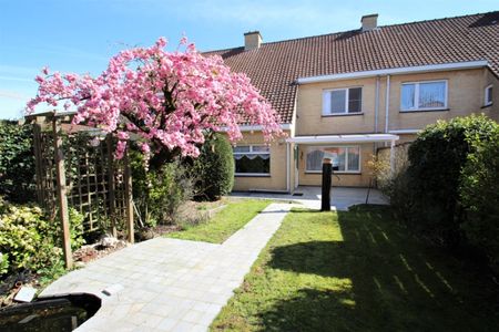 Verzorgde rijwoning met garage en tuin - Photo 4