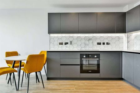 A modern apartment on an upper level with private balcony in the much sought after Horlicks development by Berkeley Homes. - Photo 5