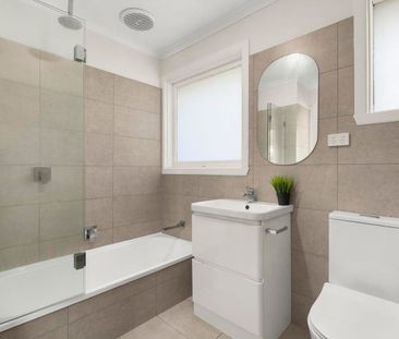 Modern Comfort Meets Suburban Charm - Photo 1