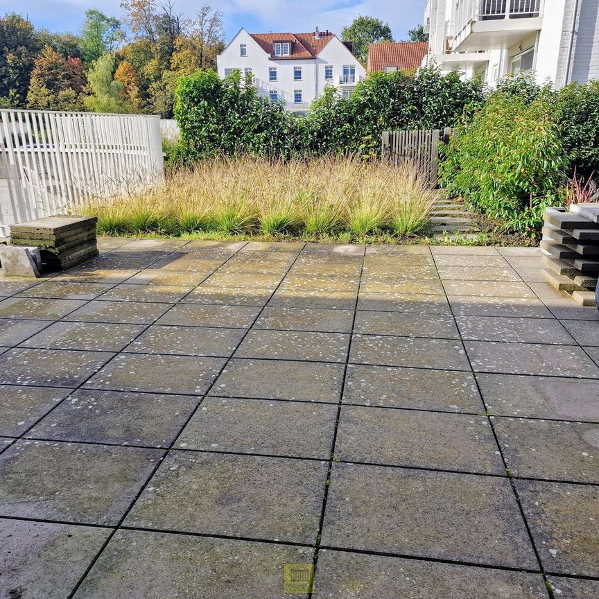 Recent gelijkvloers appartement met terras, tuintje en ondergrondse parkeerplaats! - Foto 1