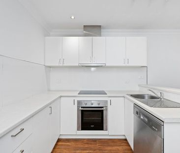 Two Bedrooms. Two Courtyards. Plenty to Love. - Photo 6