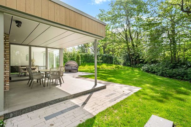 A landmark five-bedroom, five-bathroom residence set within generous south-facing gardens, located in one of the North West's most prestigious village settings. - Photo 1