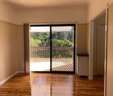 Charming Family Home with Spacious Backyard and Modern Comforts - Photo 2