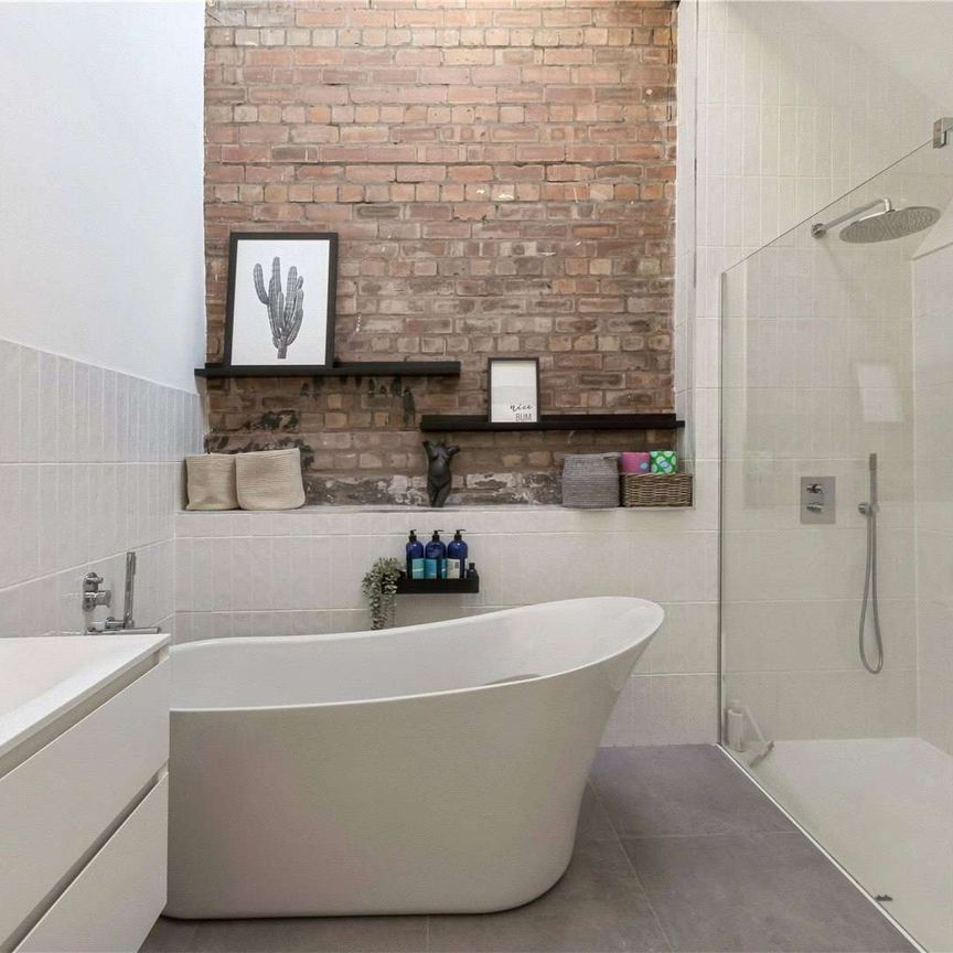 A unique 3,500 sq ft penthouse in a Grade II listed Victorian factory conversion, combining modern open-plan living with original industrial character. - Photo 1