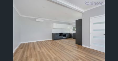 Renovated 3 bedroom home with a white picket fence - Photo 2